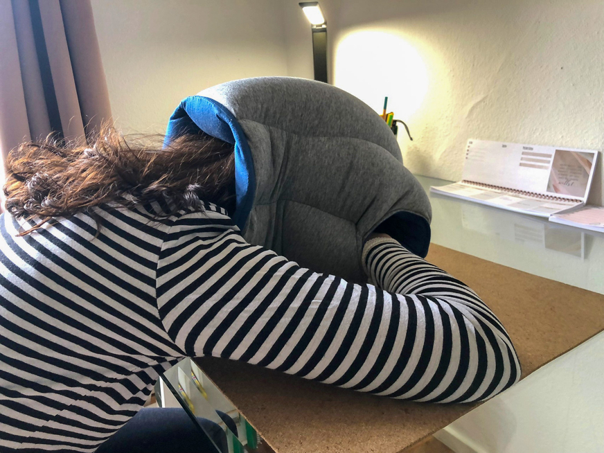 ostrichpillow original napping pillow person on desk